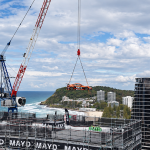 MAYD and McElrea Racing crane Tim Farrell’s Porsche GT3 Cup Car onto the rooftop of ONE Burleigh, more than 19 storeys above the Gold Coast coastline.