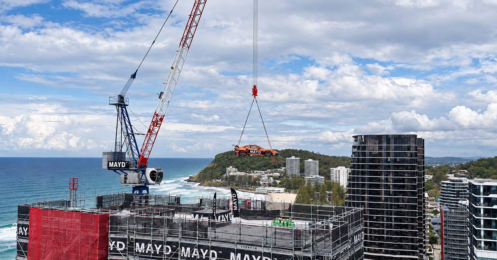 MAYD and McElrea Racing crane Tim Farrell’s Porsche GT3 Cup Car onto the rooftop of ONE Burleigh, more than 19 storeys above the Gold Coast coastline.